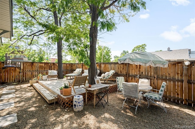 4401 Vrain St, Denver, CO 80212 - fenced backyard featuring an outdoor hangout area and a wooden deck