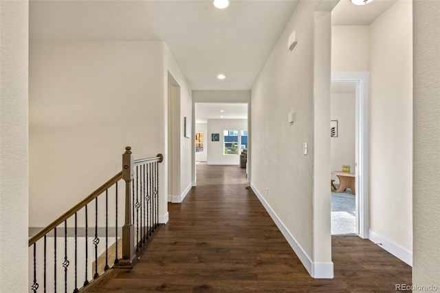 corridor featuring dark wood-type flooring