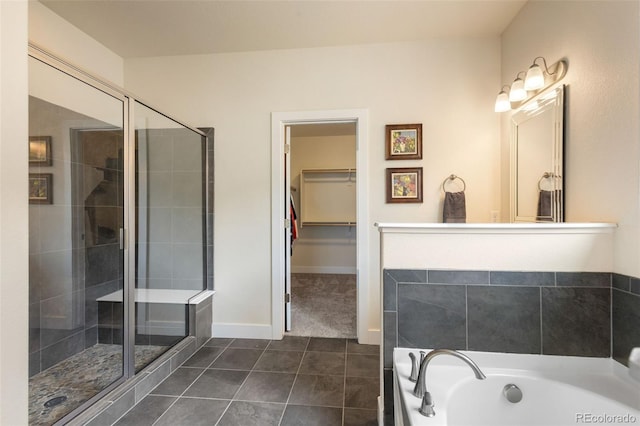 bathroom with independent shower and bath and tile floors