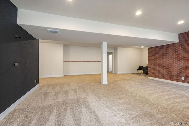 basement with light carpet and brick wall