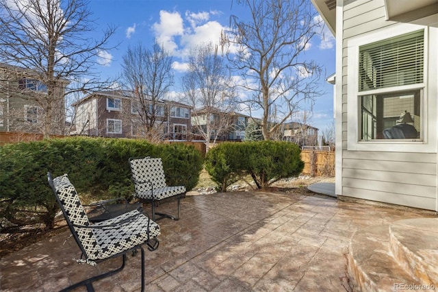 view of patio featuring fence