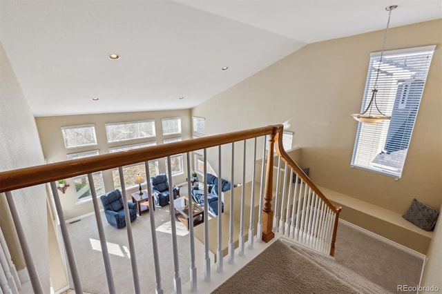 interior space with vaulted ceiling, recessed lighting, baseboards, and carpet floors