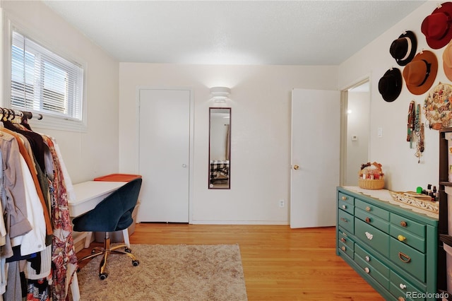 office space with light wood finished floors