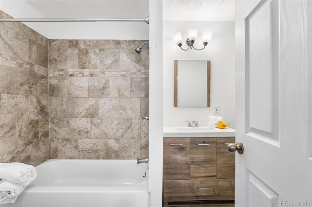 full bathroom featuring vanity, shower / bath combination, and a textured ceiling