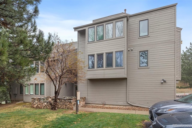 23551 Genesee Village Rd Unit H, Golden, CO 80401 - rear view of house featuring a yard