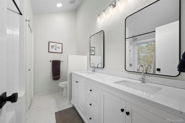 23551 Genesee Village Rd Unit H, Golden, CO 80401 - full bath with marble finish floors, toilet, double vanity, shower / bath combination, and baseboards