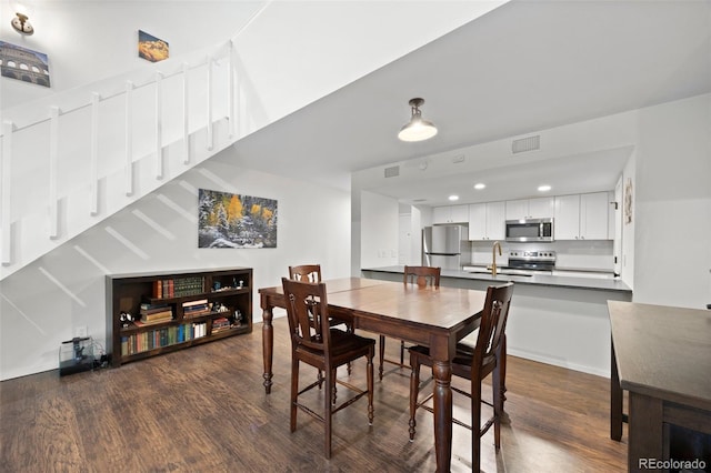 23551 Genesee Village Rd Unit H, Golden, CO 80401 - dining area with dark wood-style floors and recessed lighting