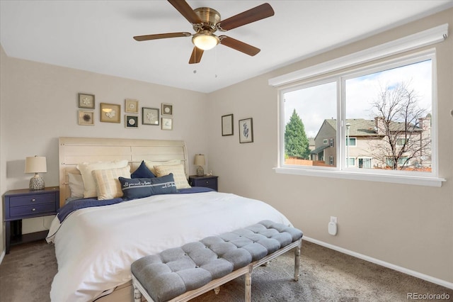 carpeted bedroom featuring baseboards and ceiling fan