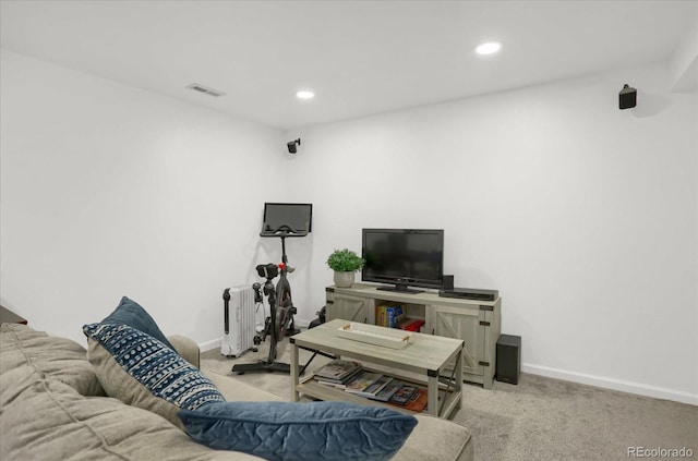 living area with radiator heating unit, carpet floors, baseboards, and recessed lighting
