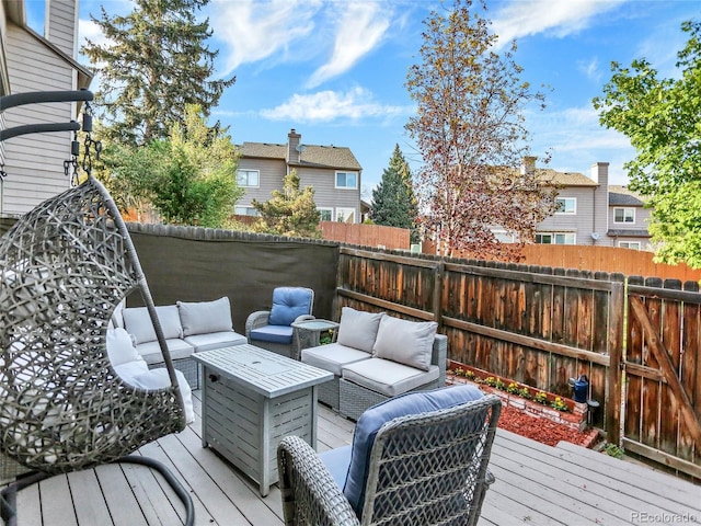 deck featuring an outdoor hangout area and a fenced backyard