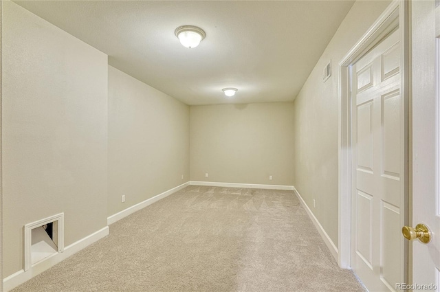 empty room featuring light colored carpet