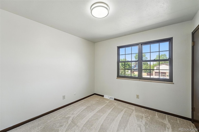 1354 S Macon St, Aurora, CO 80012 - carpeted empty room with baseboards