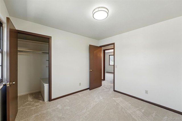 1354 S Macon St, Aurora, CO 80012 - unfurnished bedroom featuring light colored carpet, a closet, and baseboards