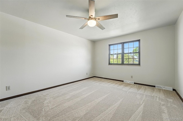 1354 S Macon St, Aurora, CO 80012 - empty room featuring ceiling fan, baseboards, and light carpet