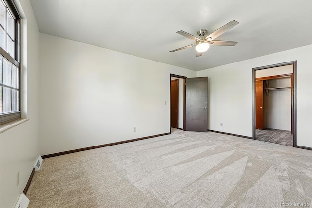 1354 S Macon St, Aurora, CO 80012 - unfurnished bedroom featuring light carpet, multiple windows, and baseboards
