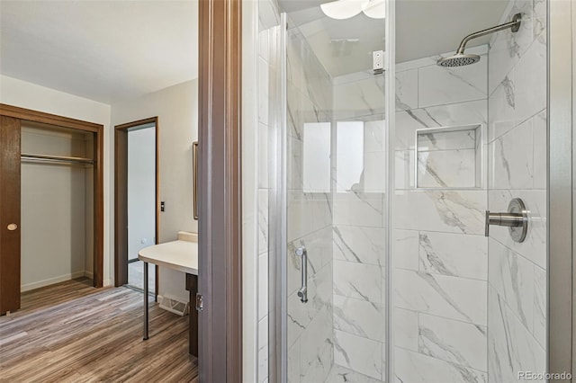 1354 S Macon St, Aurora, CO 80012 - full bathroom featuring a shower stall, wood finished floors, and baseboards