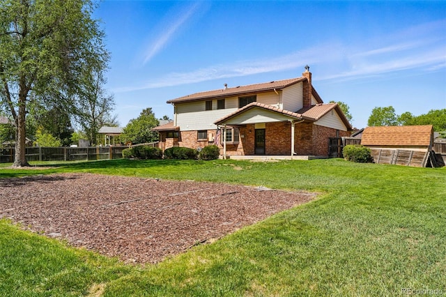 1354 S Macon St, Aurora, CO 80012 - back of property with a chimney, an outdoor structure, brick siding, a storage unit, and a patio