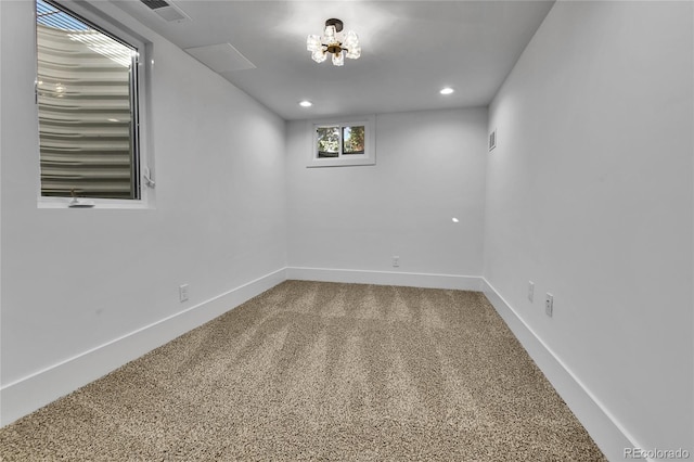 empty room featuring recessed lighting, baseboards, and carpet floors