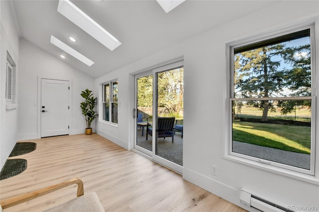 doorway featuring a baseboard radiator, a skylight, vaulted ceiling, light wood-style flooring, and baseboards