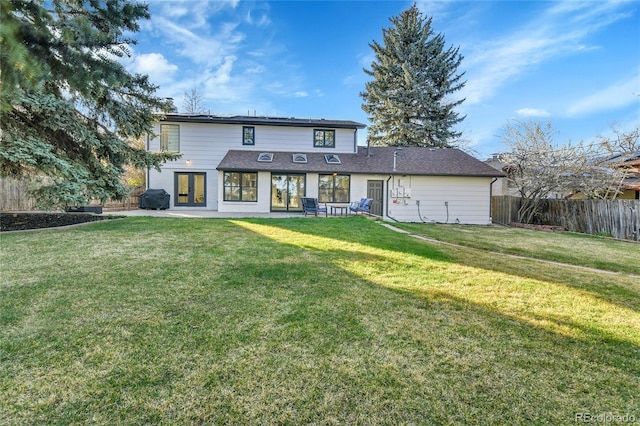 back of property featuring french doors and a patio