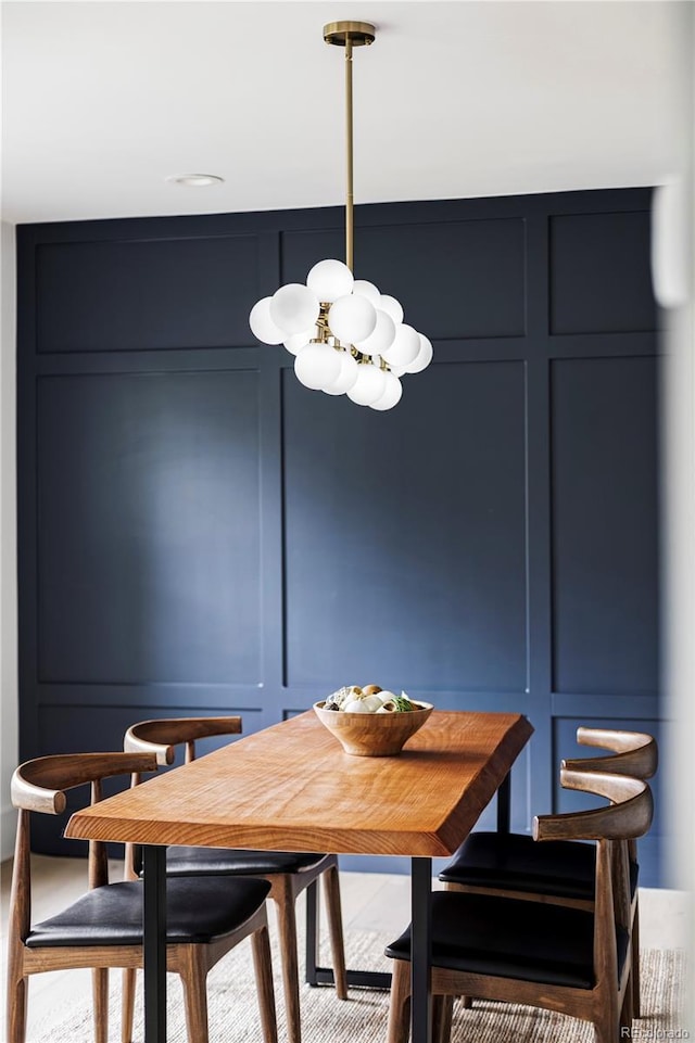 3930 S Hillcrest Dr, Denver, CO 80237 - dining space with a decorative wall and a chandelier