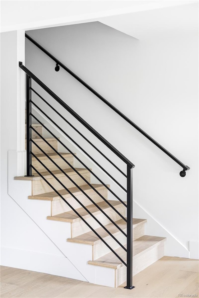 3930 S Hillcrest Dr, Denver, CO 80237 - staircase featuring wood finished floors