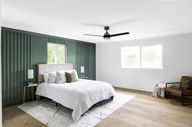 3930 S Hillcrest Dr, Denver, CO 80237 - bedroom featuring wood finished floors, baseboards, crown molding, and ceiling fan