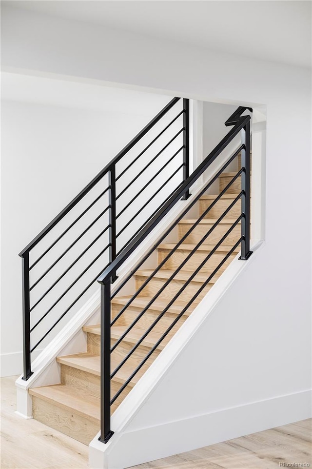 3930 S Hillcrest Dr, Denver, CO 80237 - staircase with baseboards and wood finished floors
