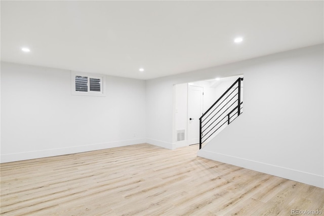 3930 S Hillcrest Dr, Denver, CO 80237 - finished below grade area featuring recessed lighting, light wood finished floors, and stairs