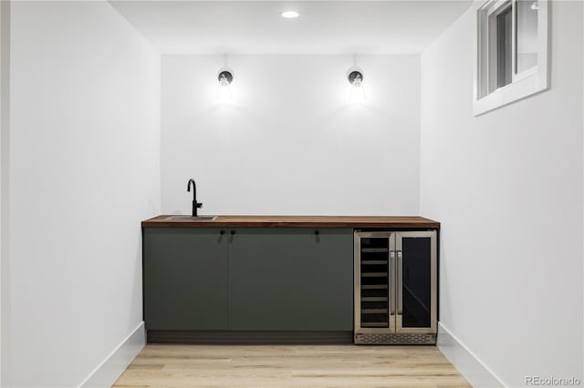3930 S Hillcrest Dr, Denver, CO 80237 - indoor wet bar with wine cooler, light wood-type flooring, and recessed lighting