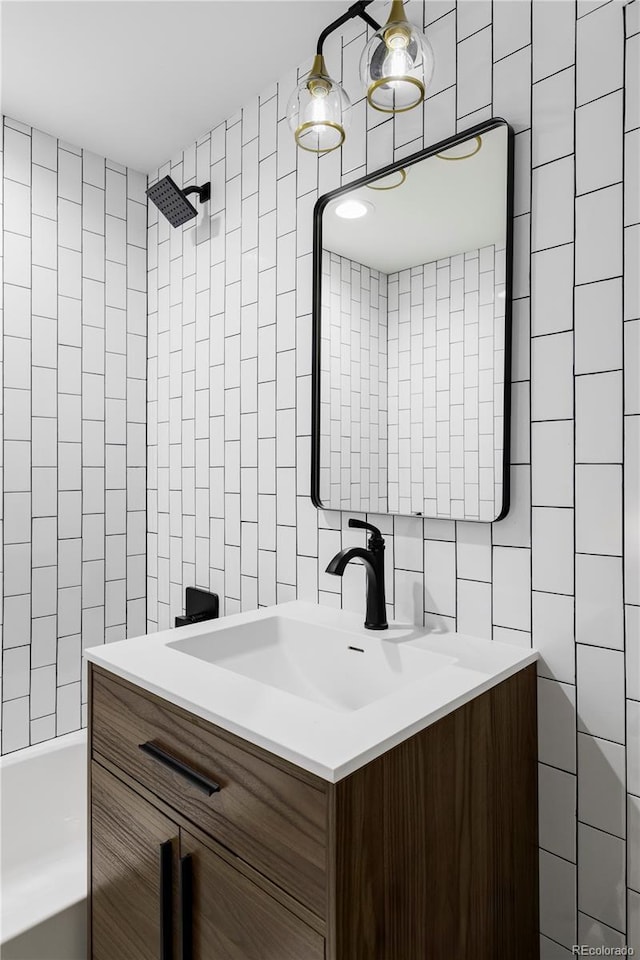 3930 S Hillcrest Dr, Denver, CO 80237 - bathroom featuring tile walls, vanity, tasteful backsplash, and bathtub / shower combination