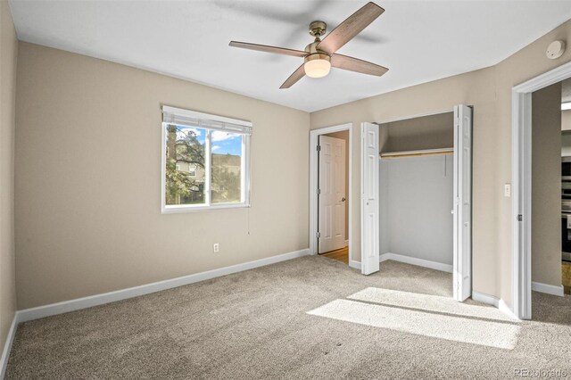 unfurnished bedroom with light colored carpet and ceiling fan