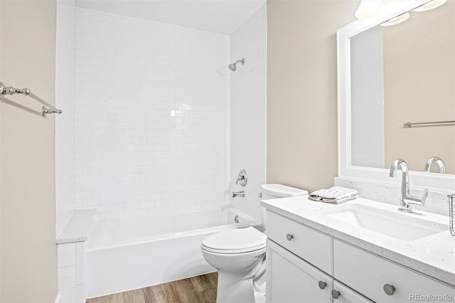 full bathroom with vanity, wood-type flooring, bathtub / shower combination, and toilet