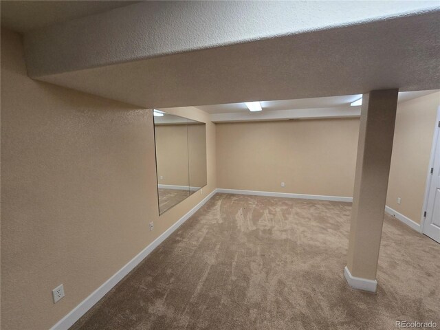 finished basement with carpet floors and baseboards