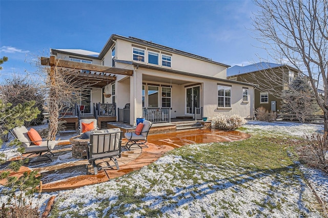 snow covered property featuring a porch