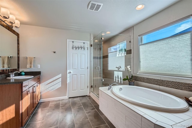 bathroom with vanity and plus walk in shower