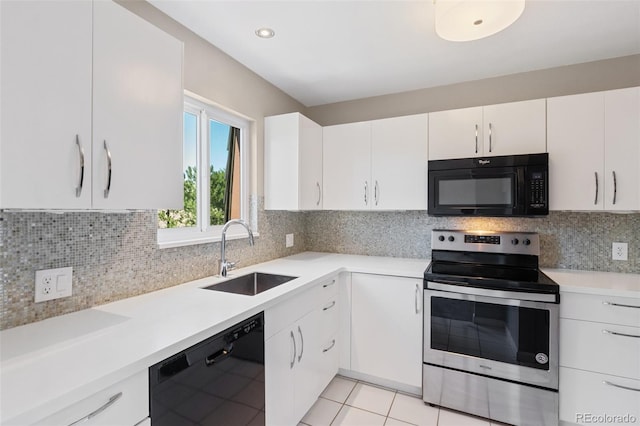 2973 Mesa Rd Unit C, Colorado Springs, CO 80904 - kitchen featuring black appliances, light countertops, white cabinets, tasteful backsplash, and light tile patterned floors