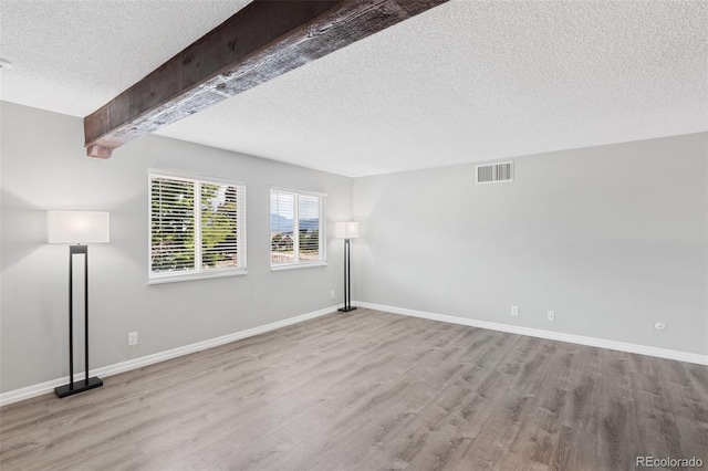 2973 Mesa Rd Unit C, Colorado Springs, CO 80904 - spare room with a textured ceiling and wood finished floors