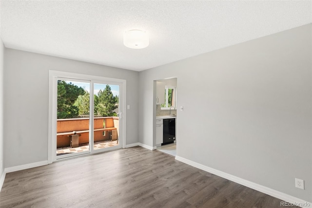 2973 Mesa Rd Unit C, Colorado Springs, CO 80904 - unfurnished living room featuring light wood-style floors and baseboards