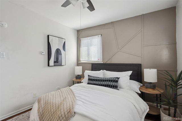 bedroom with ceiling fan and baseboards