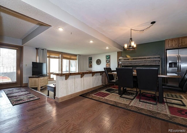 96 Mountainside Dr Unit C102, Granby, CO 80446 - dining area featuring wood finished floors, a chandelier, and recessed lighting