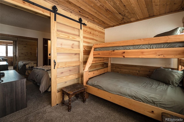 96 Mountainside Dr Unit C102, Granby, CO 80446 - carpeted bedroom featuring a barn door and wood ceiling