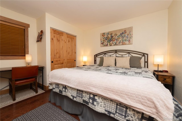 bedroom featuring a closet and dark wood-type flooring