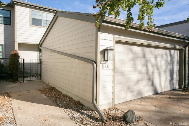 view of property exterior with a garage