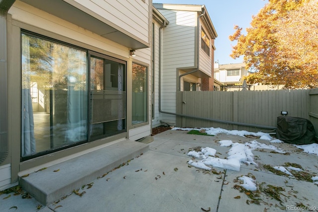 view of side of property featuring a patio area