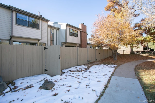 7900 W Layton Ave Unit 833, Littleton, CO 80123 - snow covered property with a gate and a chimney