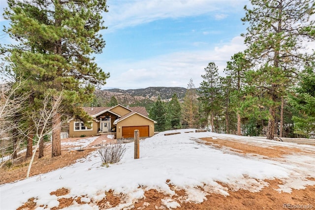 exterior space featuring a mountain view and a garage