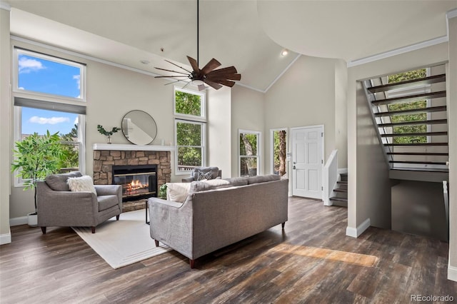 4219 Morning Star Dr, Castle Rock, CO 80108 - living room featuring stairway, ceiling fan, a fireplace, high vaulted ceiling, and dark wood-style flooring