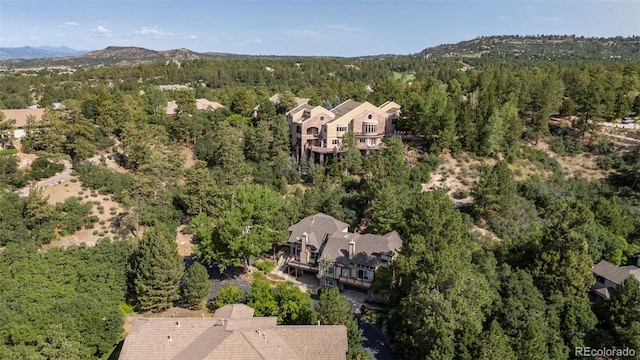 4219 Morning Star Dr, Castle Rock, CO 80108 - view of property location featuring a heavily wooded area and a mountainous background