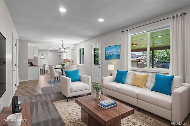 6240 W 110th Pl, Westminster, CO 80020 - living area with recessed lighting, plenty of natural light, wood finished floors, and a chandelier